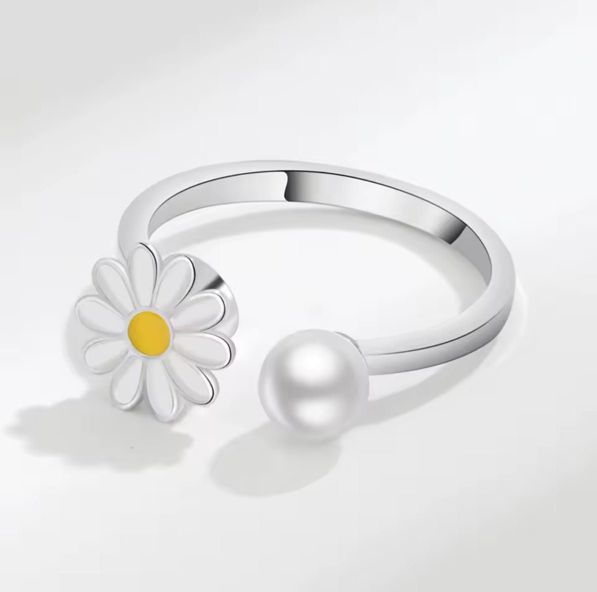 Draaibare ring met madeliefjes
