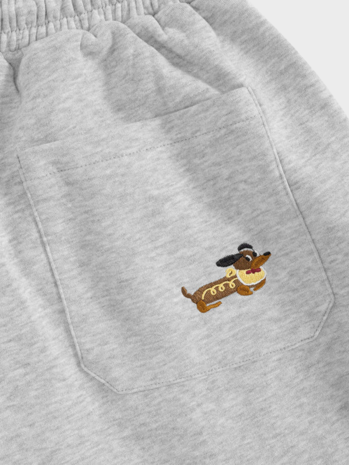 Mooibelle geborduurde joggingbroek met puppy-print