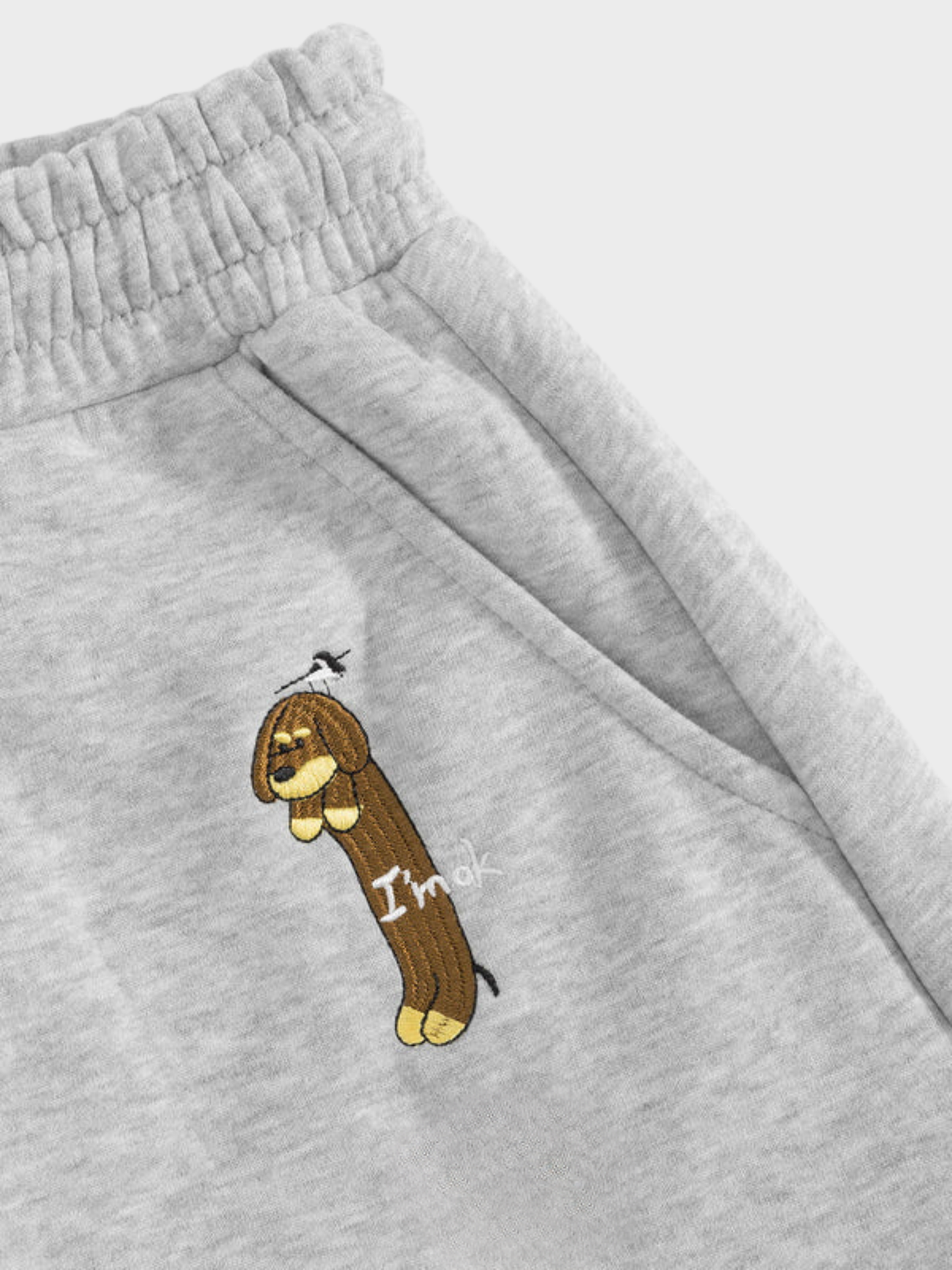 Mooibelle geborduurde joggingbroek met puppy-print